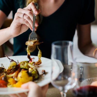 woman eating in restaurant